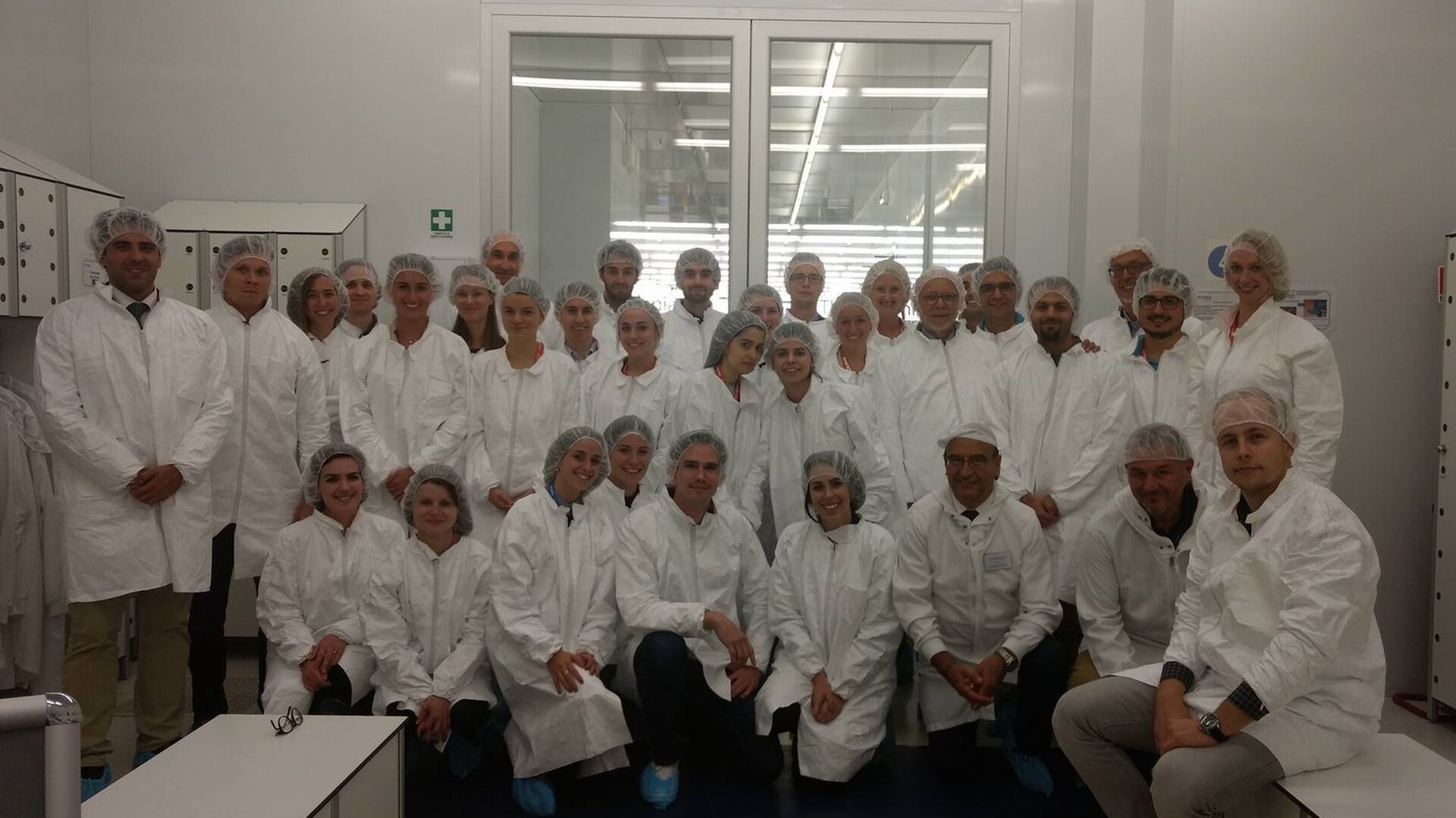 Participants ready to enter the clean room at Thales Alenia 