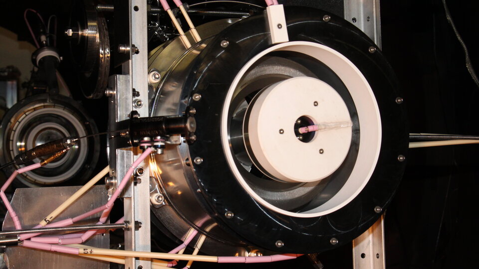 Thruster inside vacuum chamber