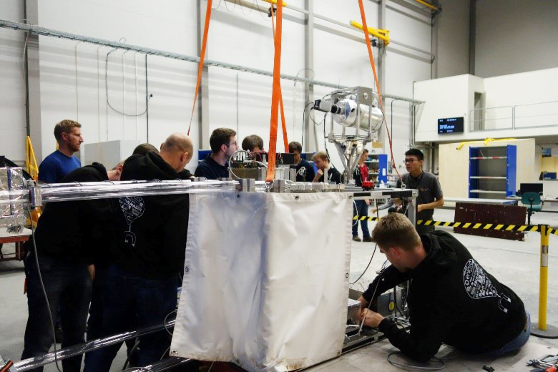 BEXUS 24/25 students fixing their experiment to the gondola