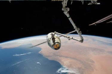 Dragon spacecraft leaving Space Station