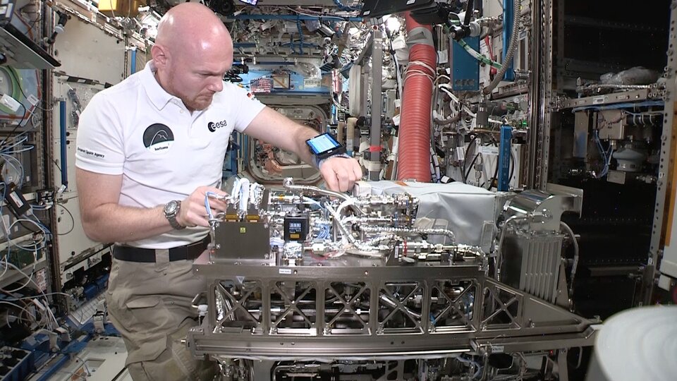ESA astronaut Alexander Gerst installs a new life support system on the International Space Station (ISS)