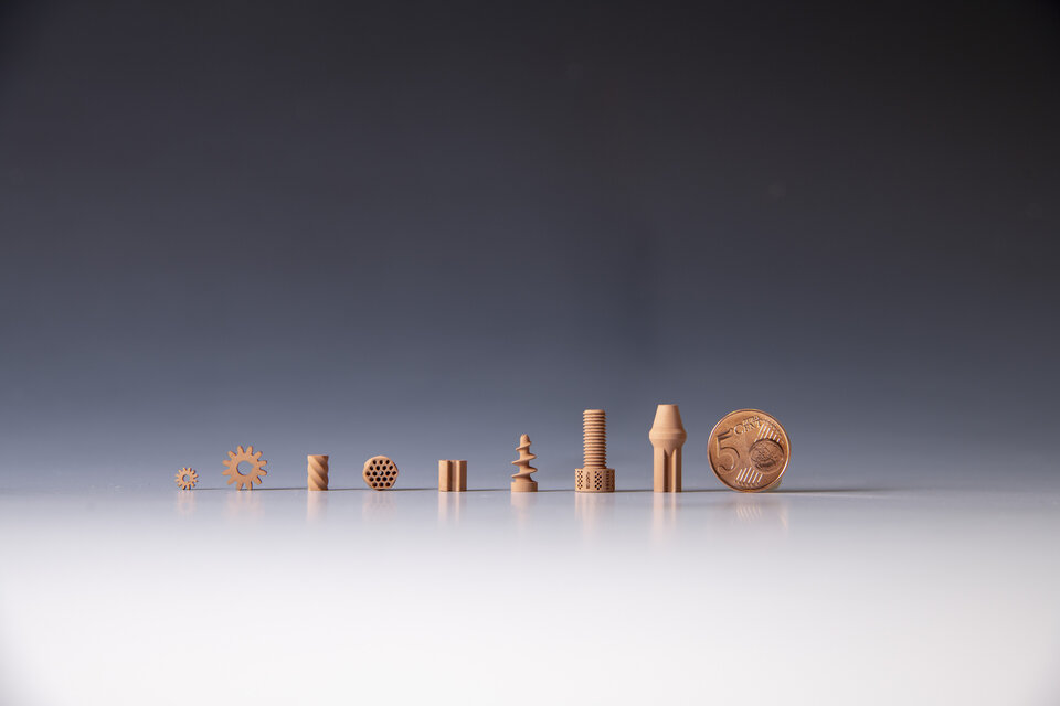 Finely-detailed ceramic parts printed from a lunar soil-like material using lithography-based ceramic manufacturing. The ceramic pieces will be displayed at the Science Museum in London.