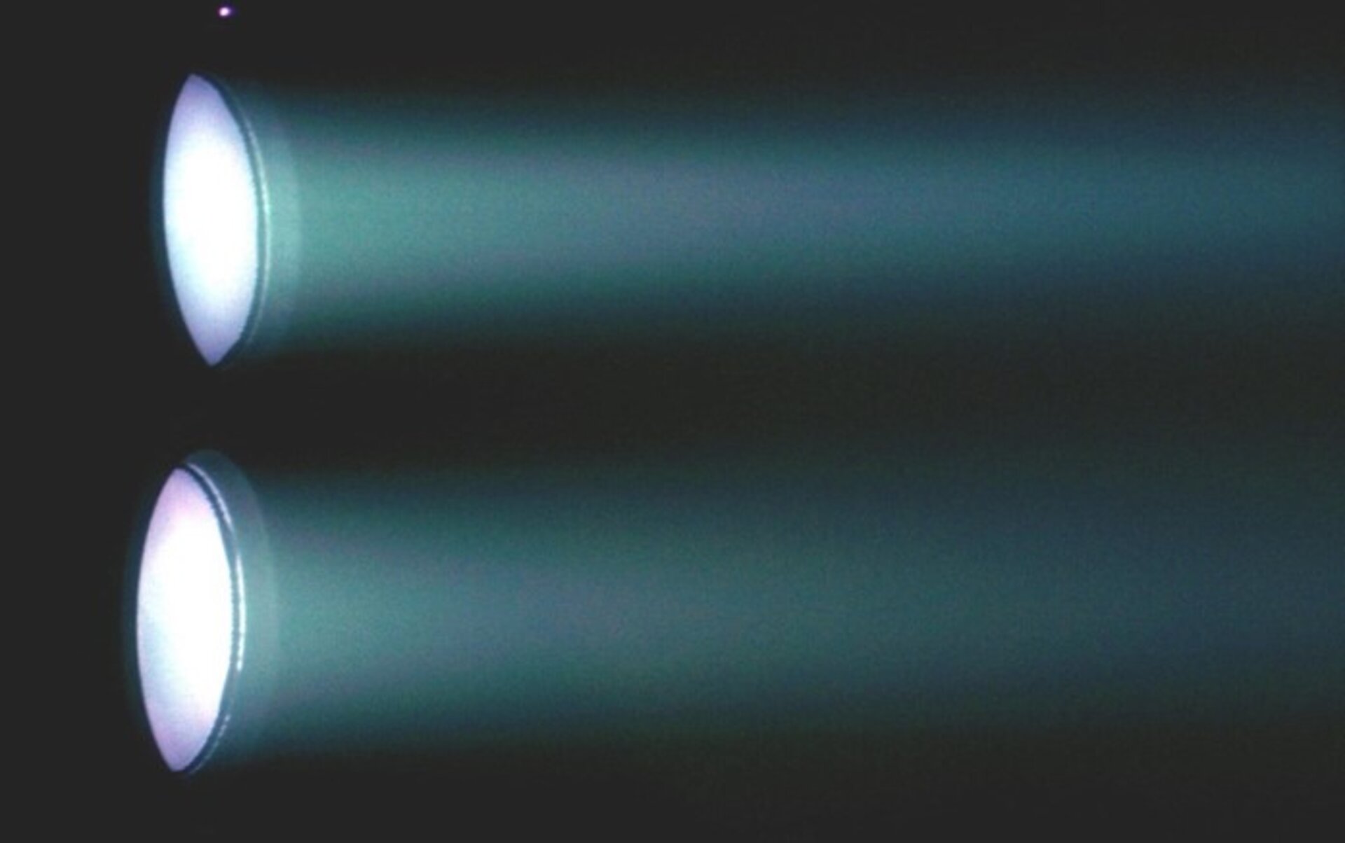 Twin ion thrusters firing