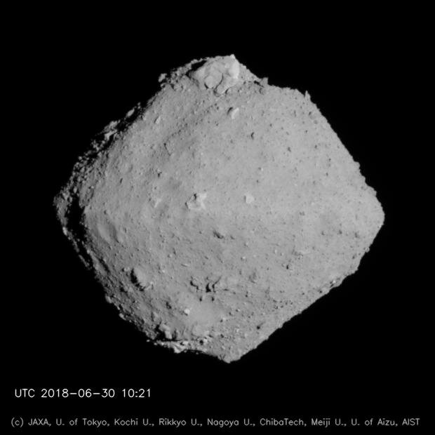 Asteroid Ryugu with north polar boulder