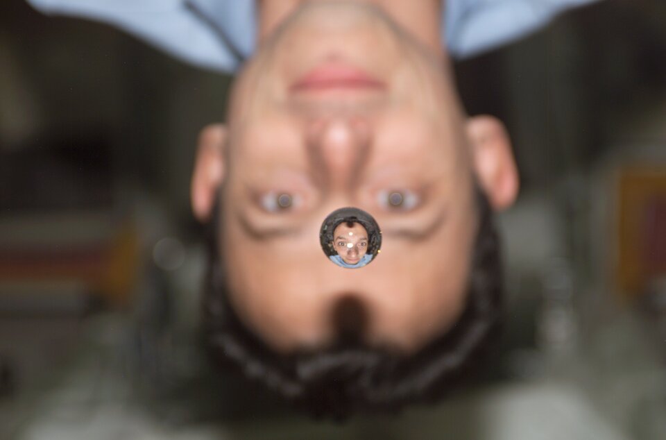 Astronaut Pedro Duque through a water drop