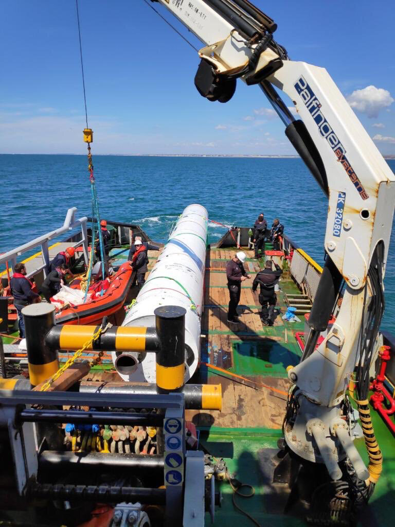 Demonstrator hoisted onto tugboat