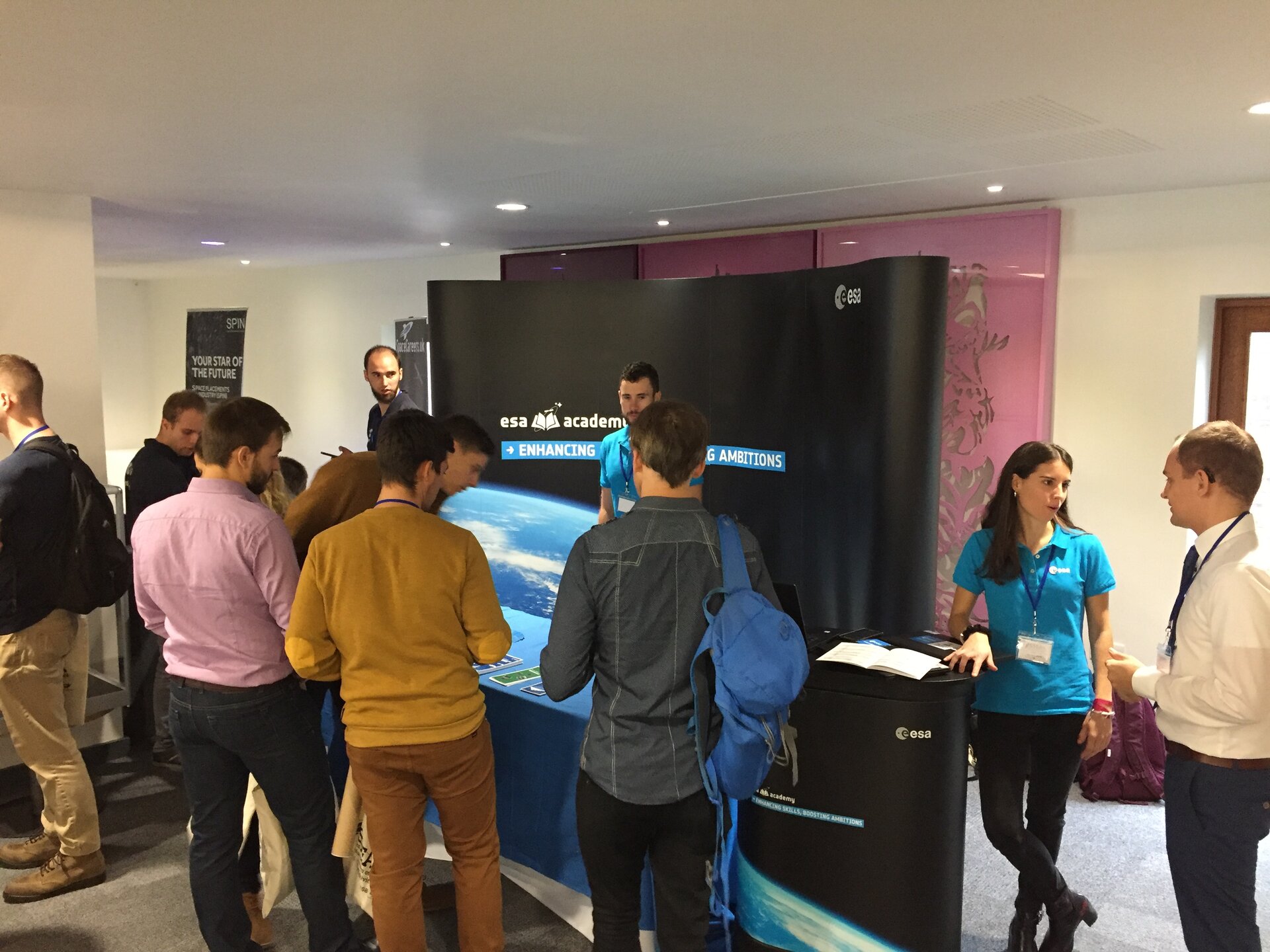 Conference attendees discussing at the ESA Education Office stand