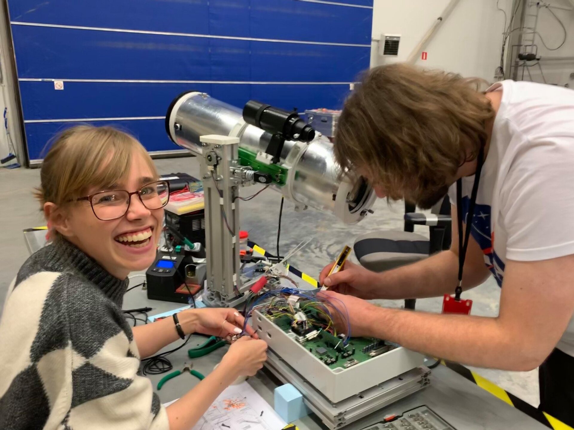 IRISC Team working on their experiment before flight