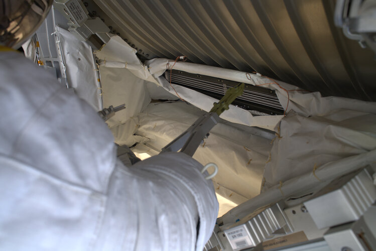 Luca Parmitano cuts tubes during his second spacewalk of Beyond