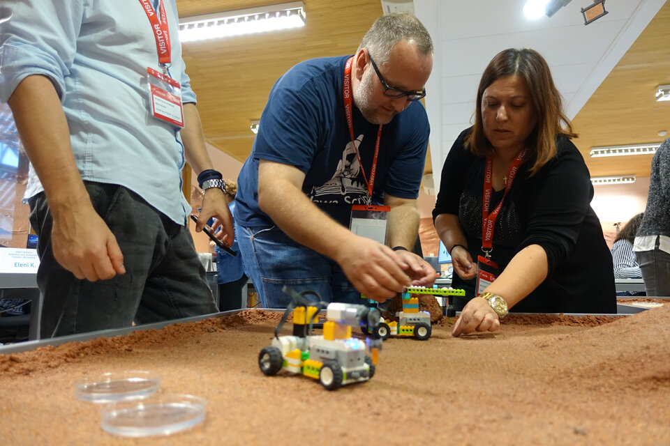 Primary school teachers exploring the surface of planet Mars.