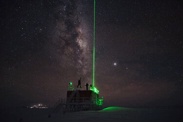A laser shoots into the sky to study the Antarctic atmosphere at Concordia research station
