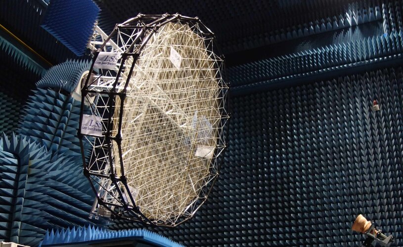 Mesh reflector for shaped radio beams