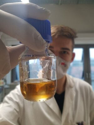  A jar containing ionic liquid used to dissolve lunar regolith simulant for oxygen extraction experiments.