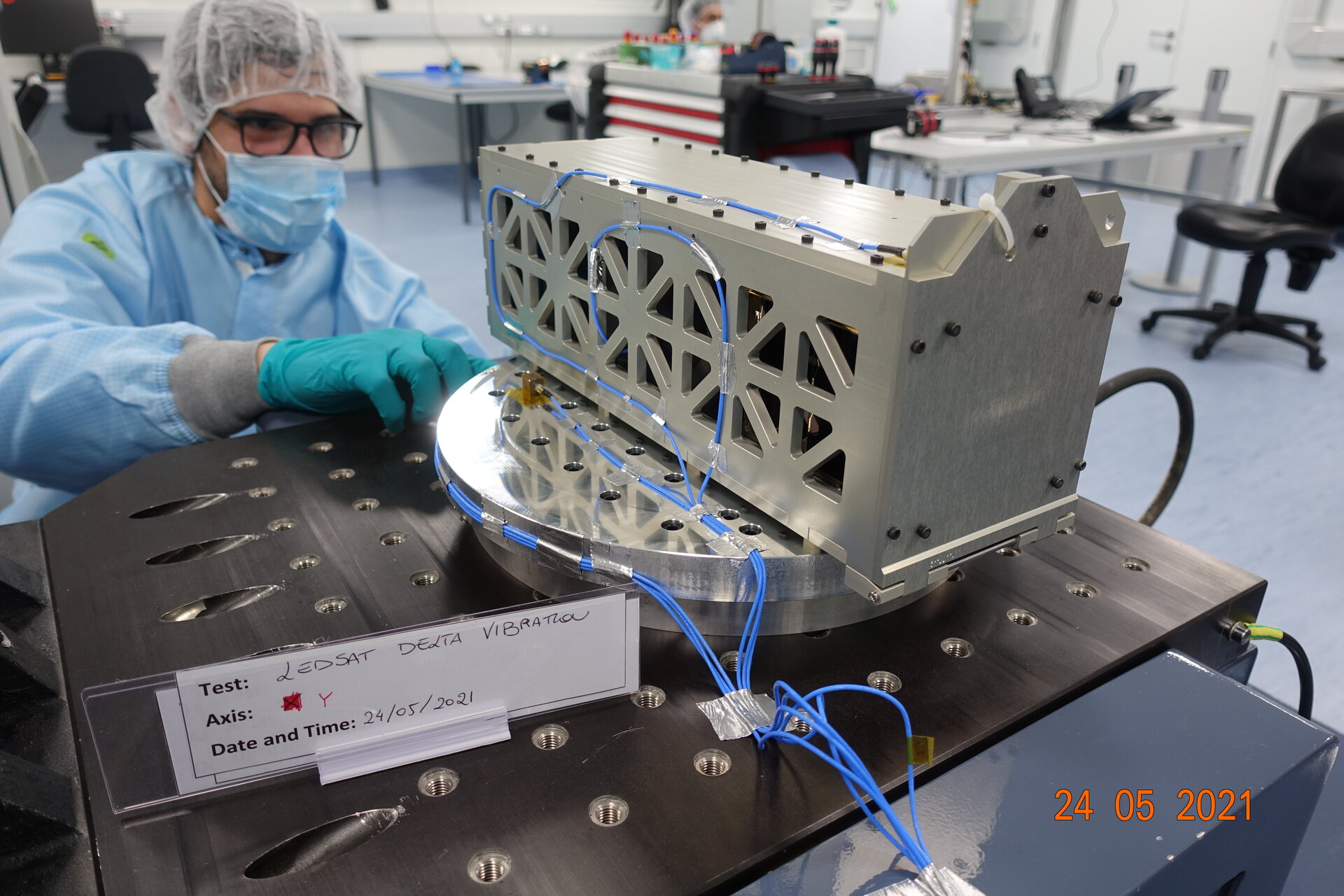 The integrated CubeSat and deployer is prepared on the shaker