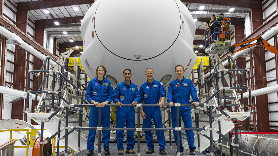 Crew-3 astronauts with their Crew Dragon Endurance spacecraft in Hangar 39A at NASA's Kennedy Space Center