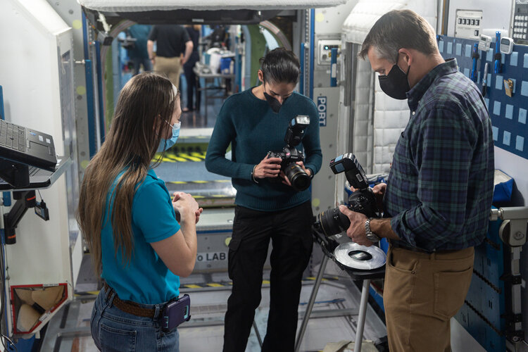 ESA astronaut Andreas Mogensen and NASA astronaut Jasmin Moghbeli train in camera skills