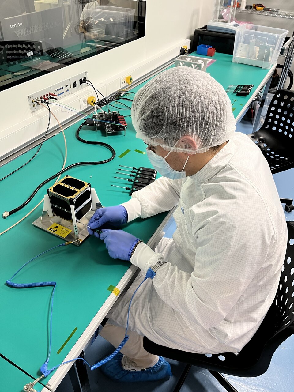 One of the 3Cat4 students working on the fully integrated CubeSat.