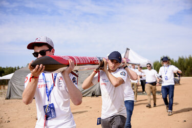 Students of the Swiss EPFL Rocket Team carrying their rocket Bella Lui 2 to the launch site