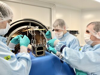 3Cat-4 team preparing the set-up for the CubeSat Thermal Vacuum Test