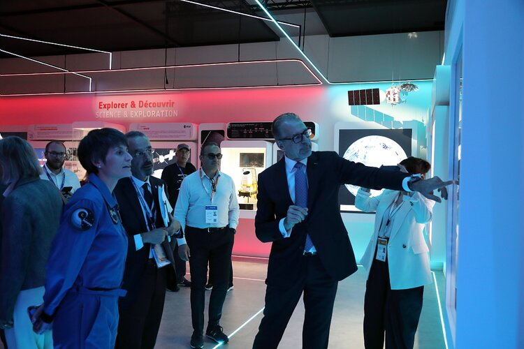 ESA astronaut Samantha Cristoforetti and Teodoro Valente, President of ASI, visit ESA's exhibition with ESA Director General Josef Aschbacher.