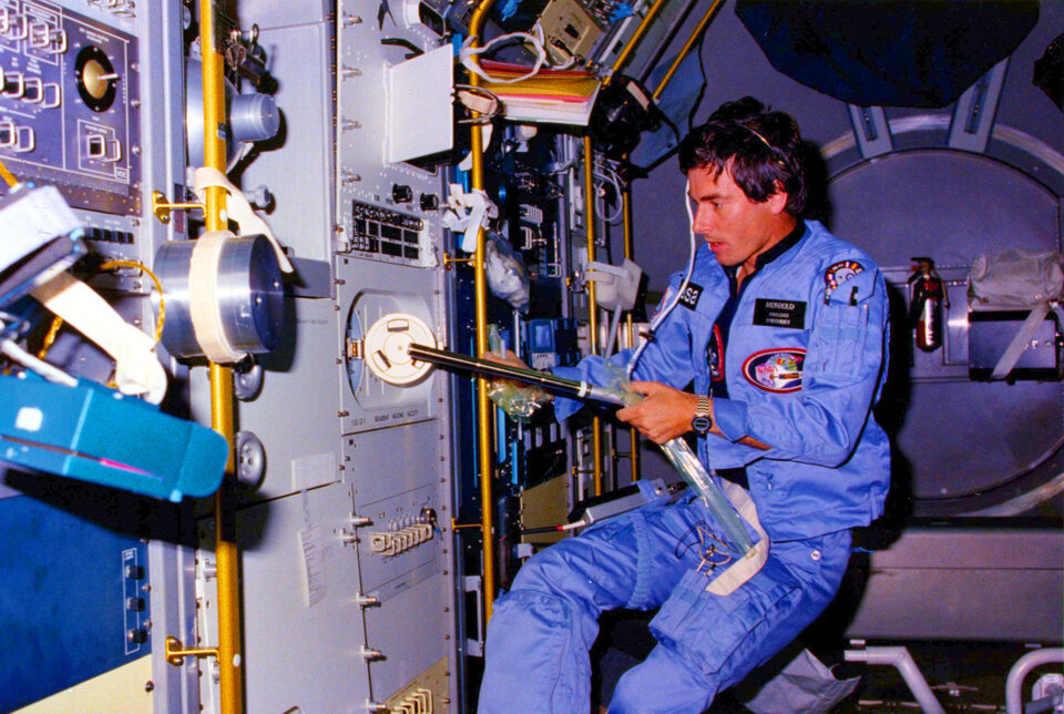Ulf Merbold working in Spacelab