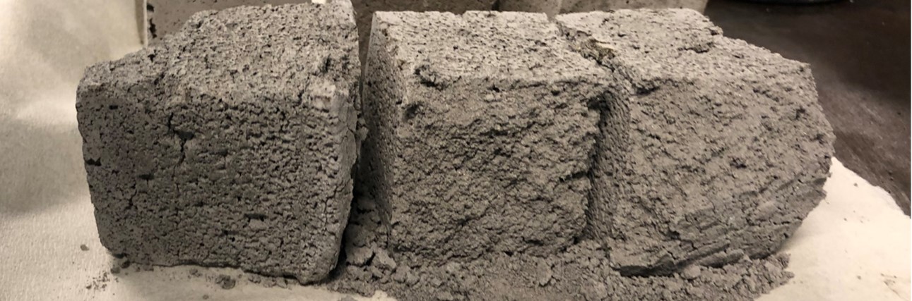Bricks made from lunar geopolymer, a cement-like inorganic material