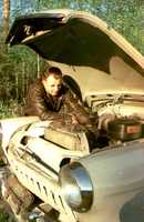 Gagarin repairing a car