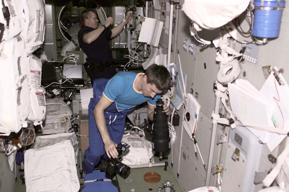 Sergei K. Krikalev and William M.  Shepherd at work in the ISS