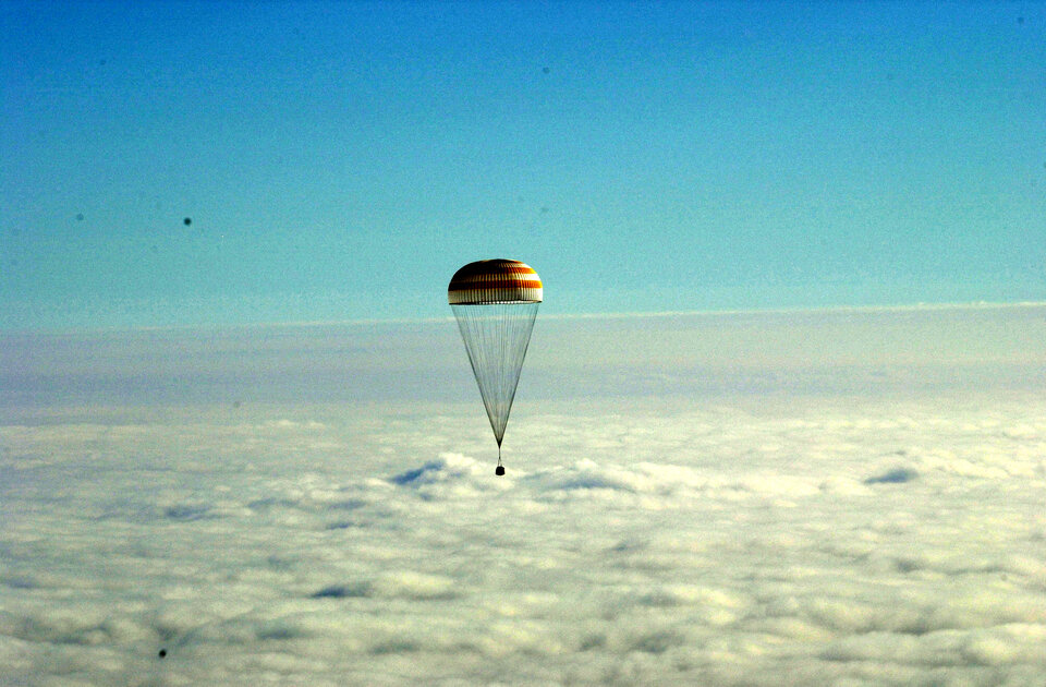 A parachute will slow the capsule's fall after entering Earth's atmosphere