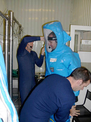 Martyn Kramer being helped out of his SCAPE suit