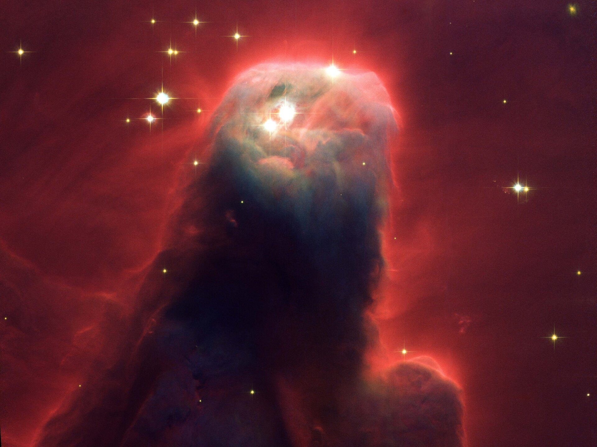 Cone Nebula, a ghostly star-forming pillar of gas and dust