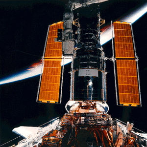 Hubble, with Earth visible in background