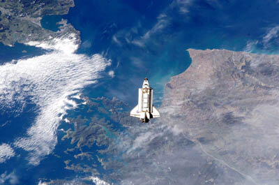 Endeavour is backdropped over New Zealand as it approaches the ISS