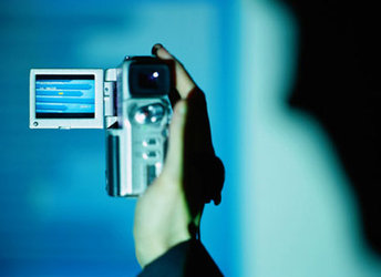 Hand holding a digital video camera