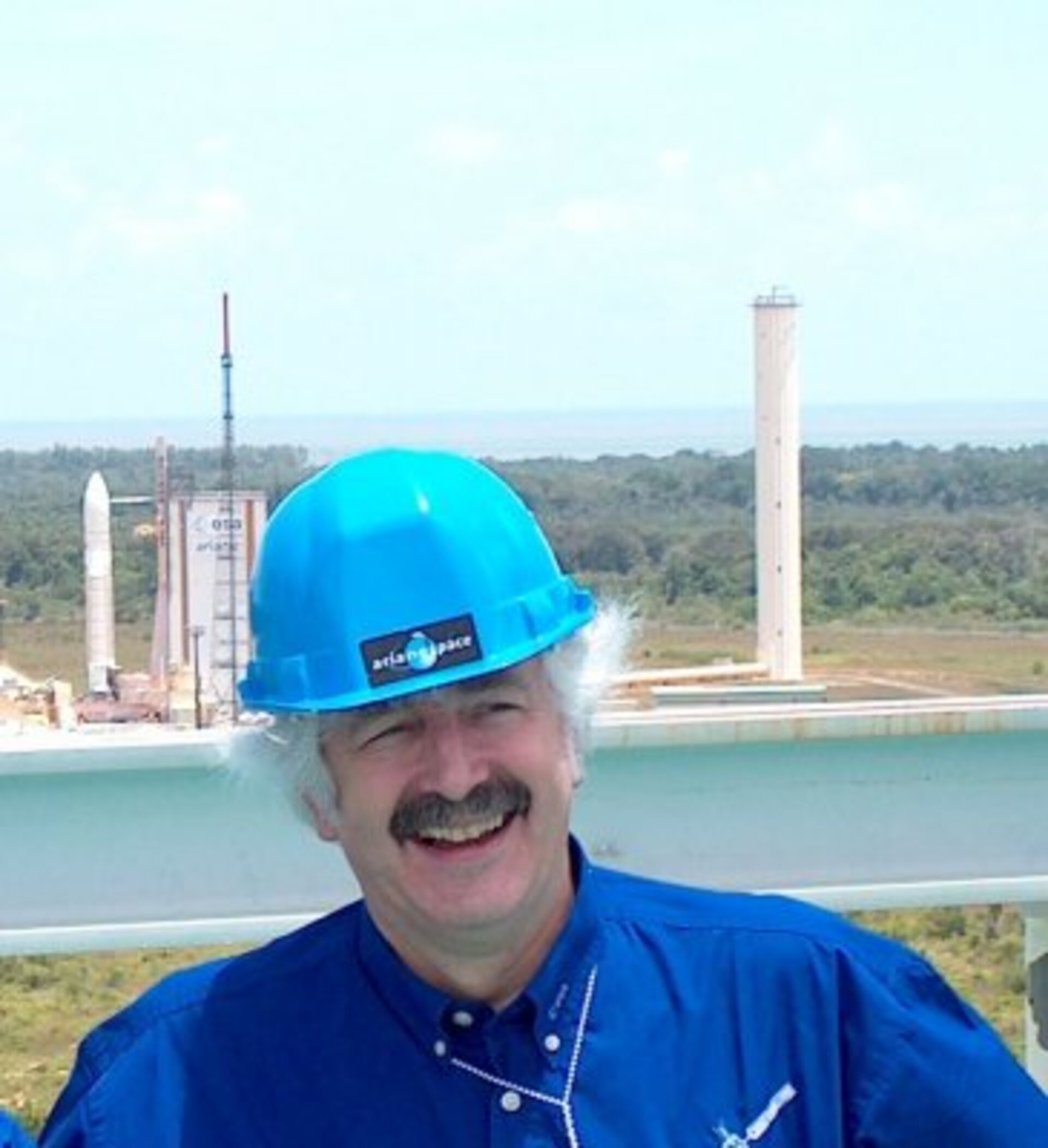 David Southwood on top of the Ariane 4 launch tower with Ariane 5 countdown preparations going on in the background