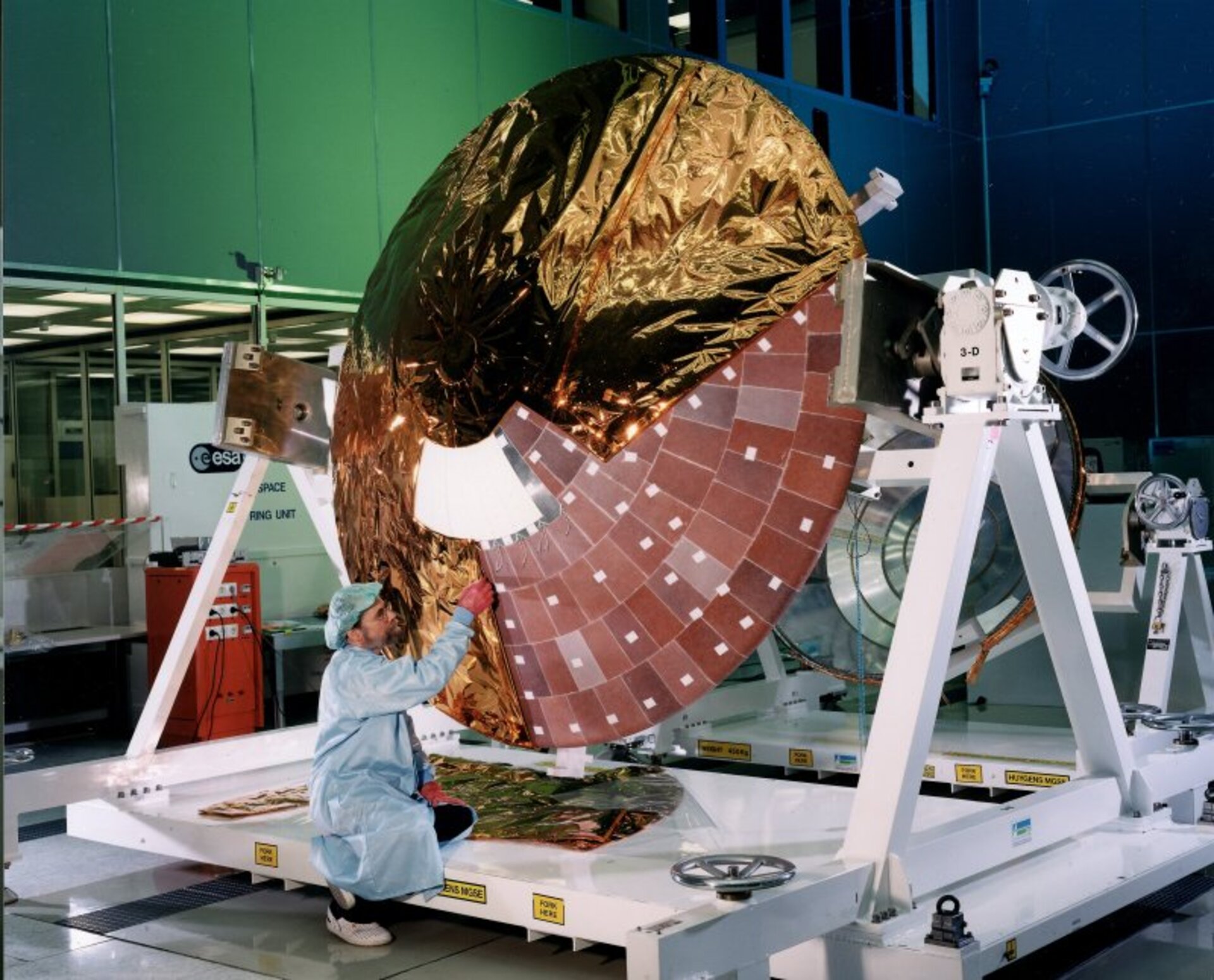 Installation of the multi-layer insulation blankets on Huygens' front shield.