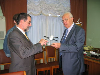 Robert Lainé, ESA’s ATV programme manager, presents a model of the ATV Jules Verne to Yuri Semenov, president of RSC-Energia