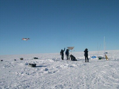 Scientific aircraft passing over ground team