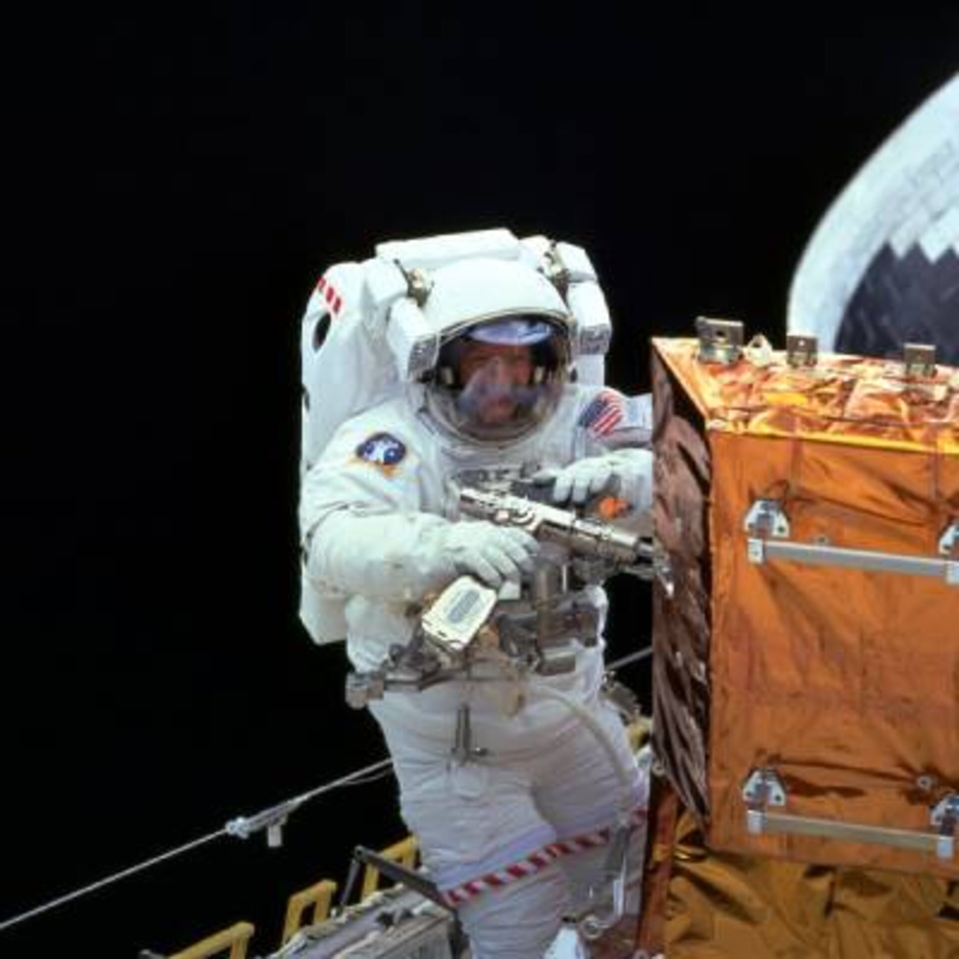 Claude Nicollier repairing Hubble