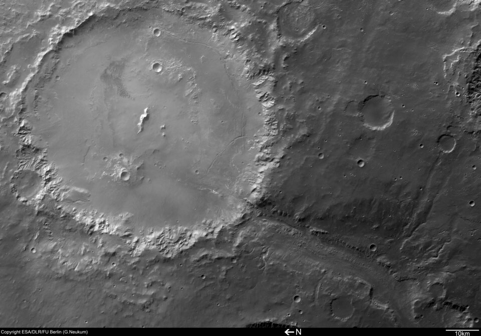 Black and white image of Crater Holden and Uzboi Vallis
