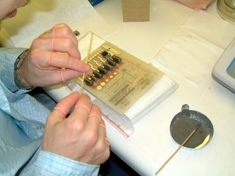 Gluing heavy components onto the power distribution unit