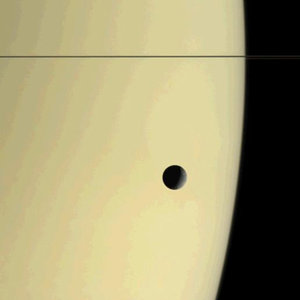 Tethys drifts above Saturn