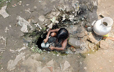 A Bangladeshi girl collects drinking water