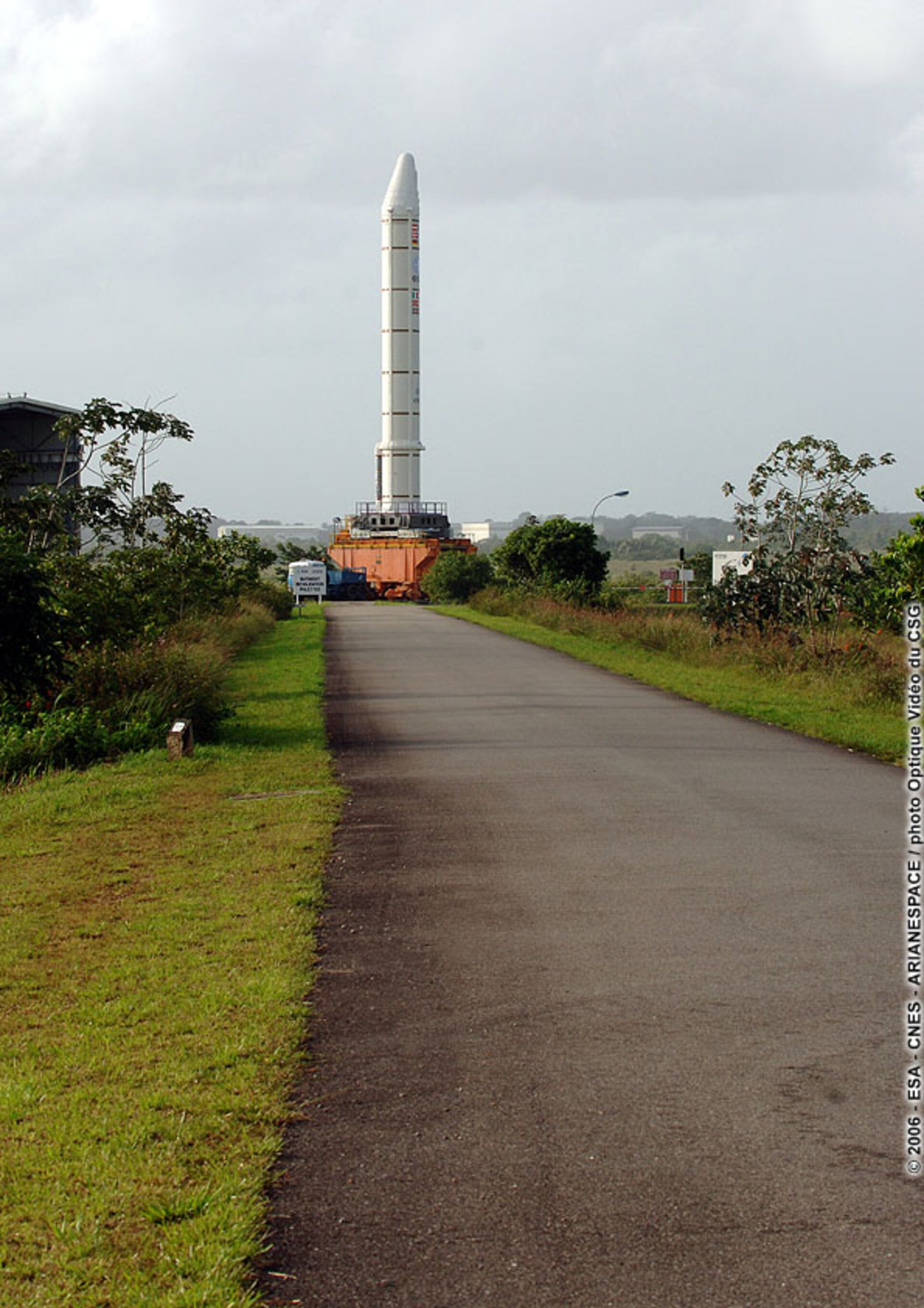 An Ariane 5 Solid Booster Stage, on a transporter, leaves the Booster Storage Building