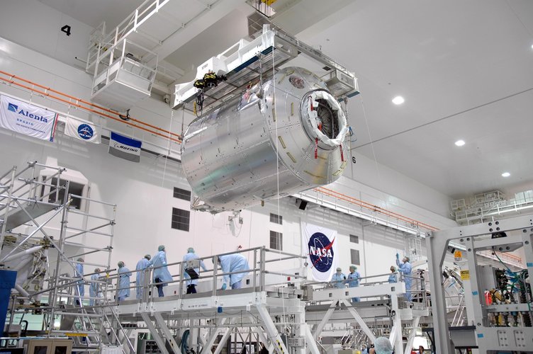 Columbus laboratory is transfered to a work stand inside the Space Station Processing Facility at NASA's Kennedy Space Center