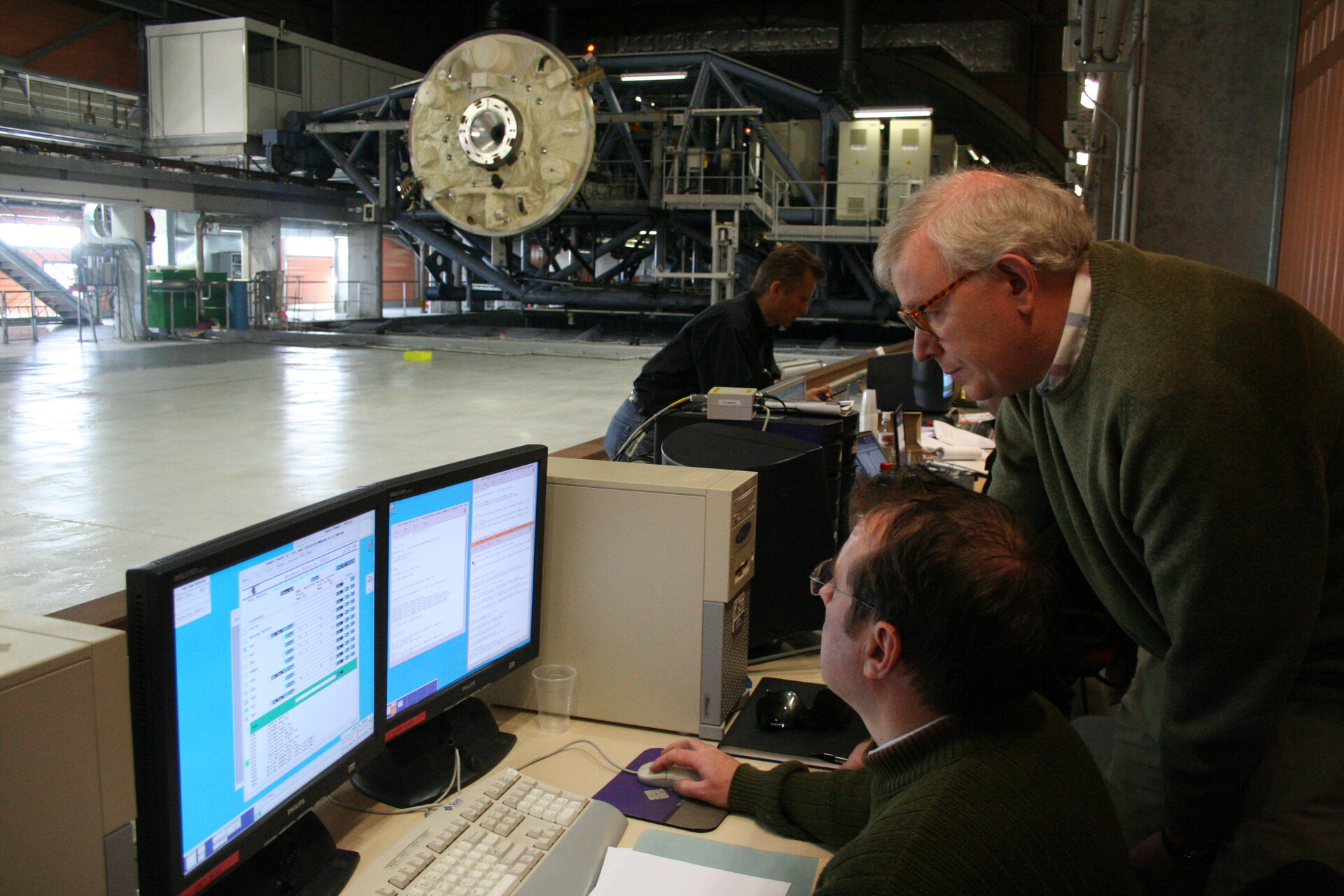 Engineers monitor the simulation
