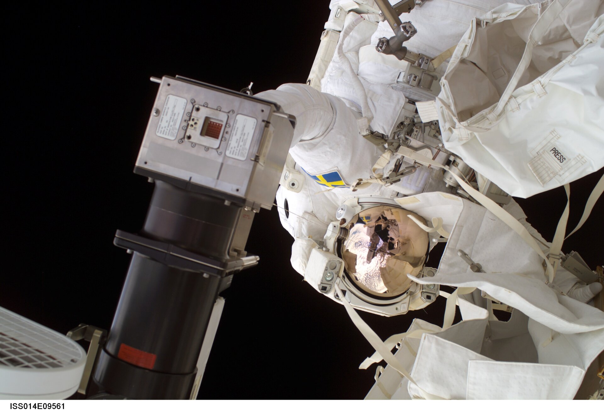 Astronaut Christer Fuglesang replaces a faulty TV camera on the exterior of the International Space Station