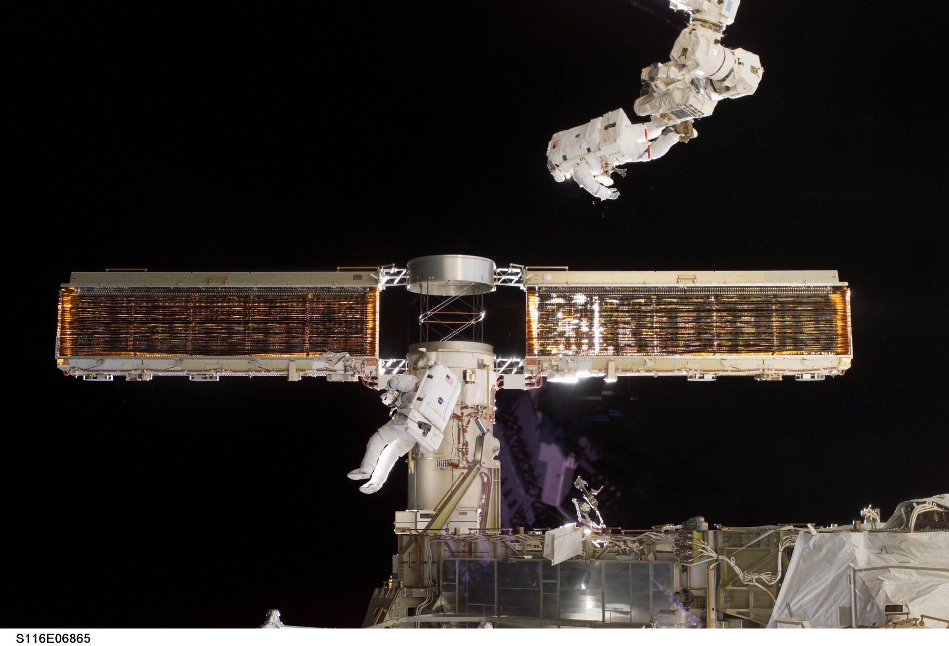 The P6 solar array is successfully retracted following an extra spacewalk