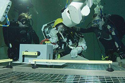 Eurobot could play an important role in EVA support - here Eurobot hands a tool to the astronaut