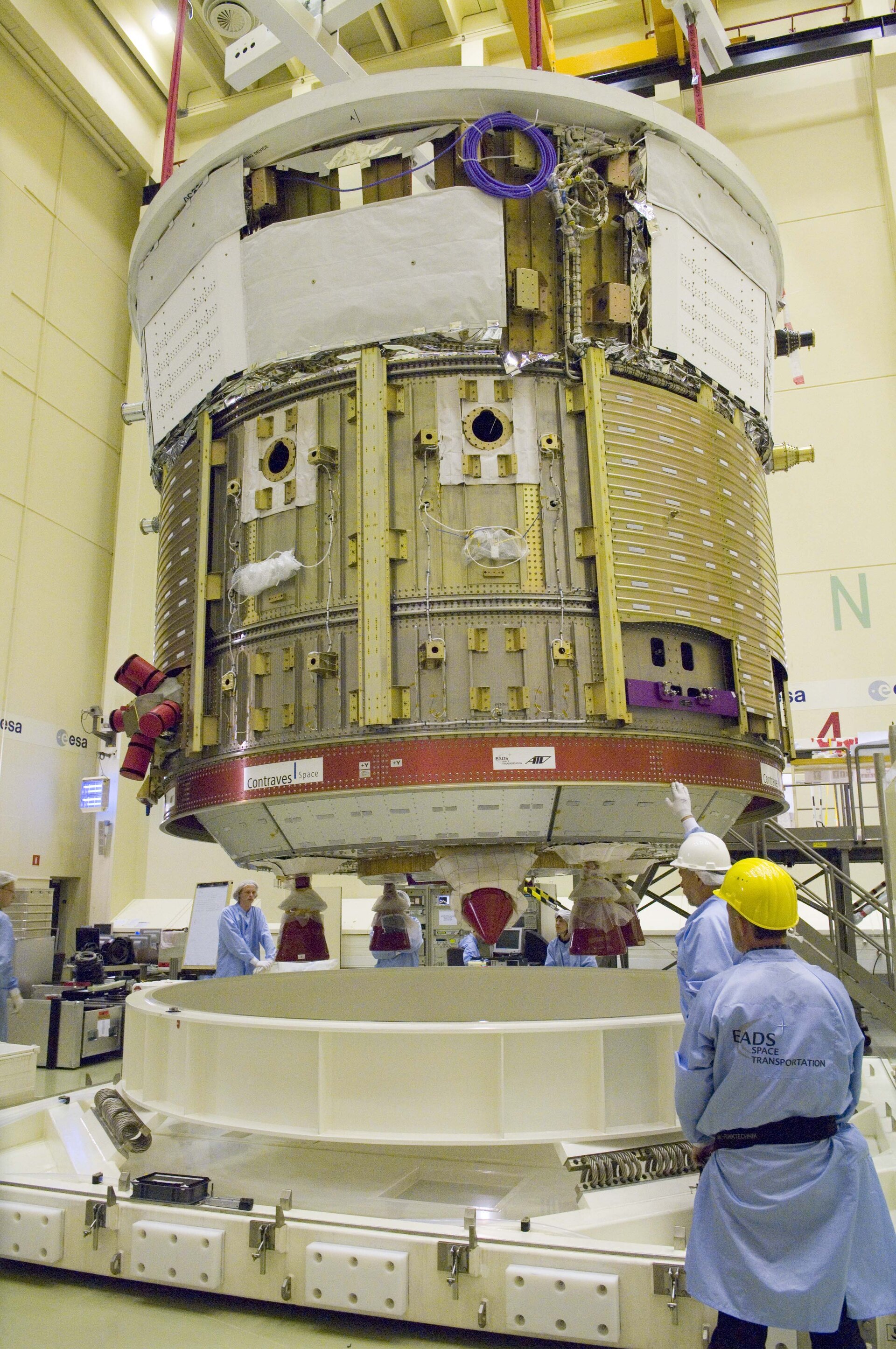 Section of ATV spacecraft is lowered onto transportation trolley
